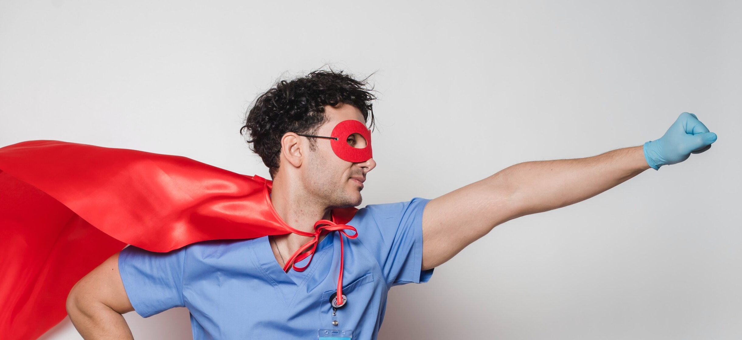 man in scrubs wearing superhero costume
